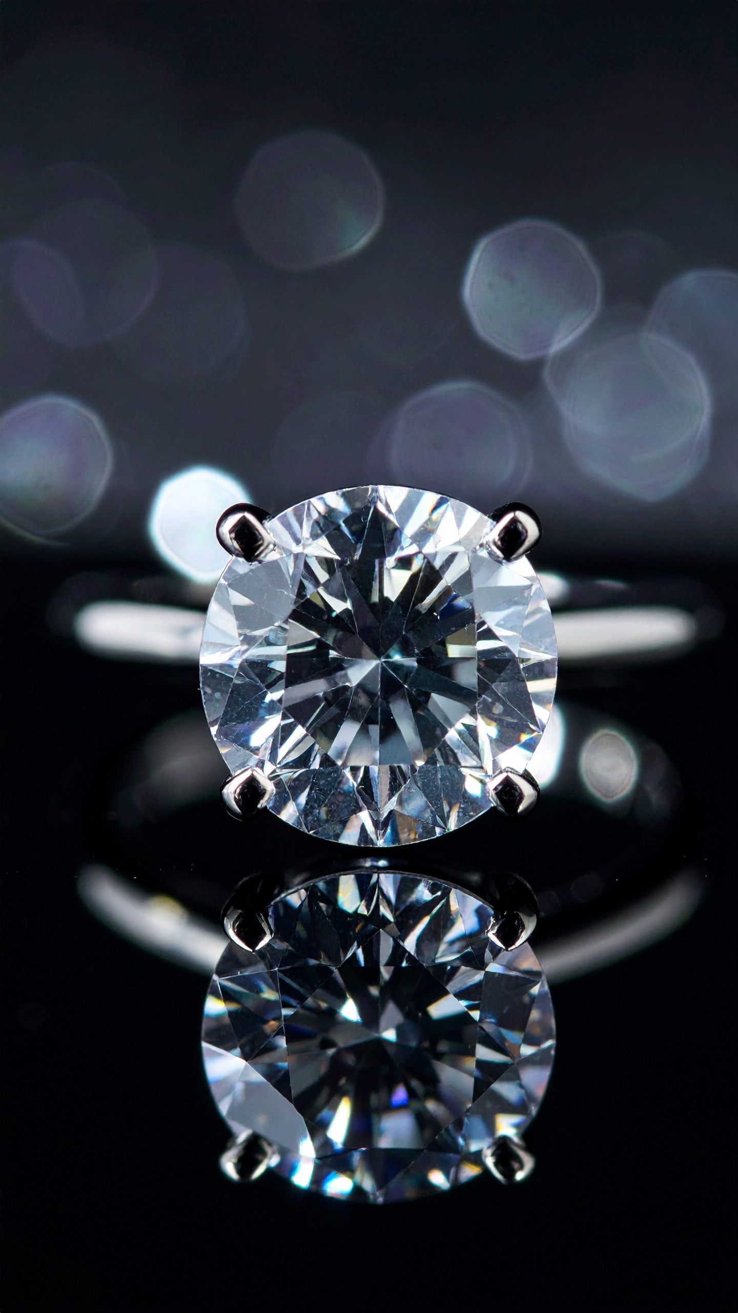 A dazzling diamond ring sparkles elegantly against a dark background