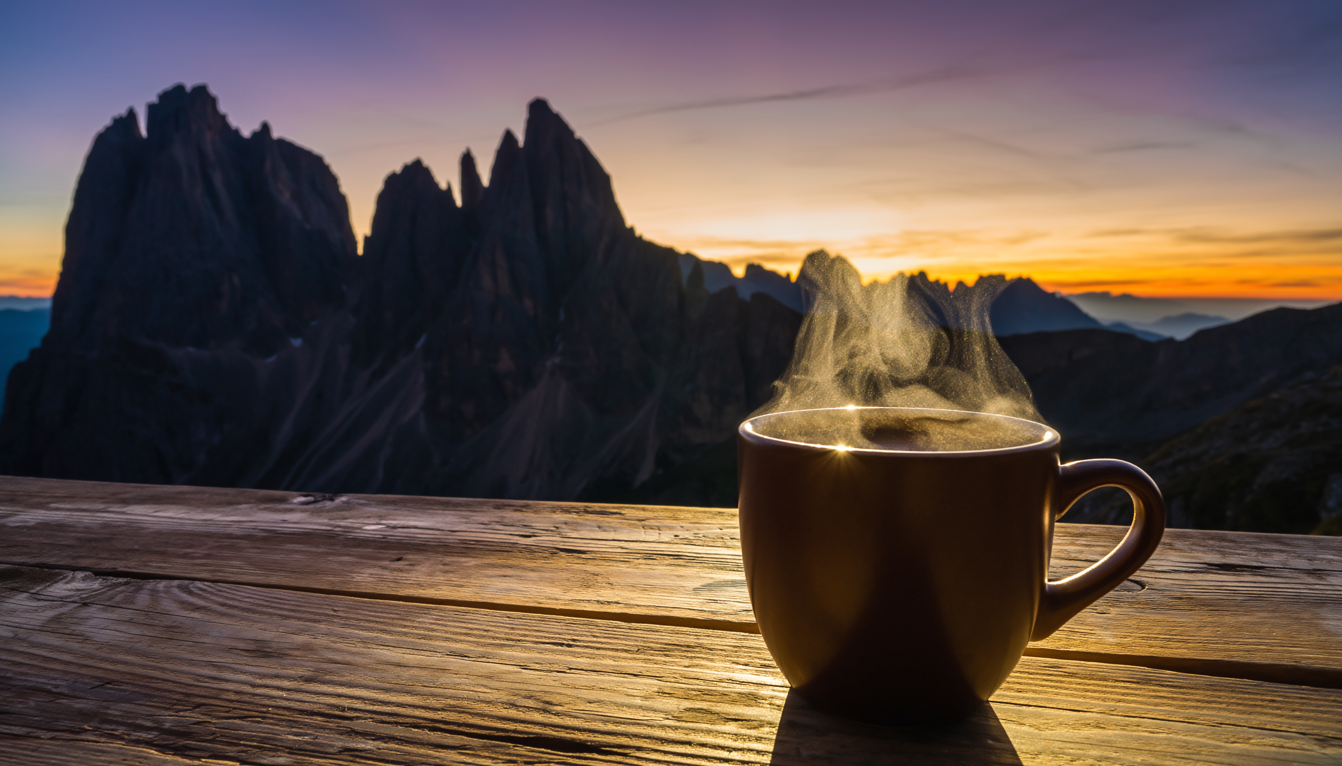 Steaming Coffee Cup on Rustic Wooden Table