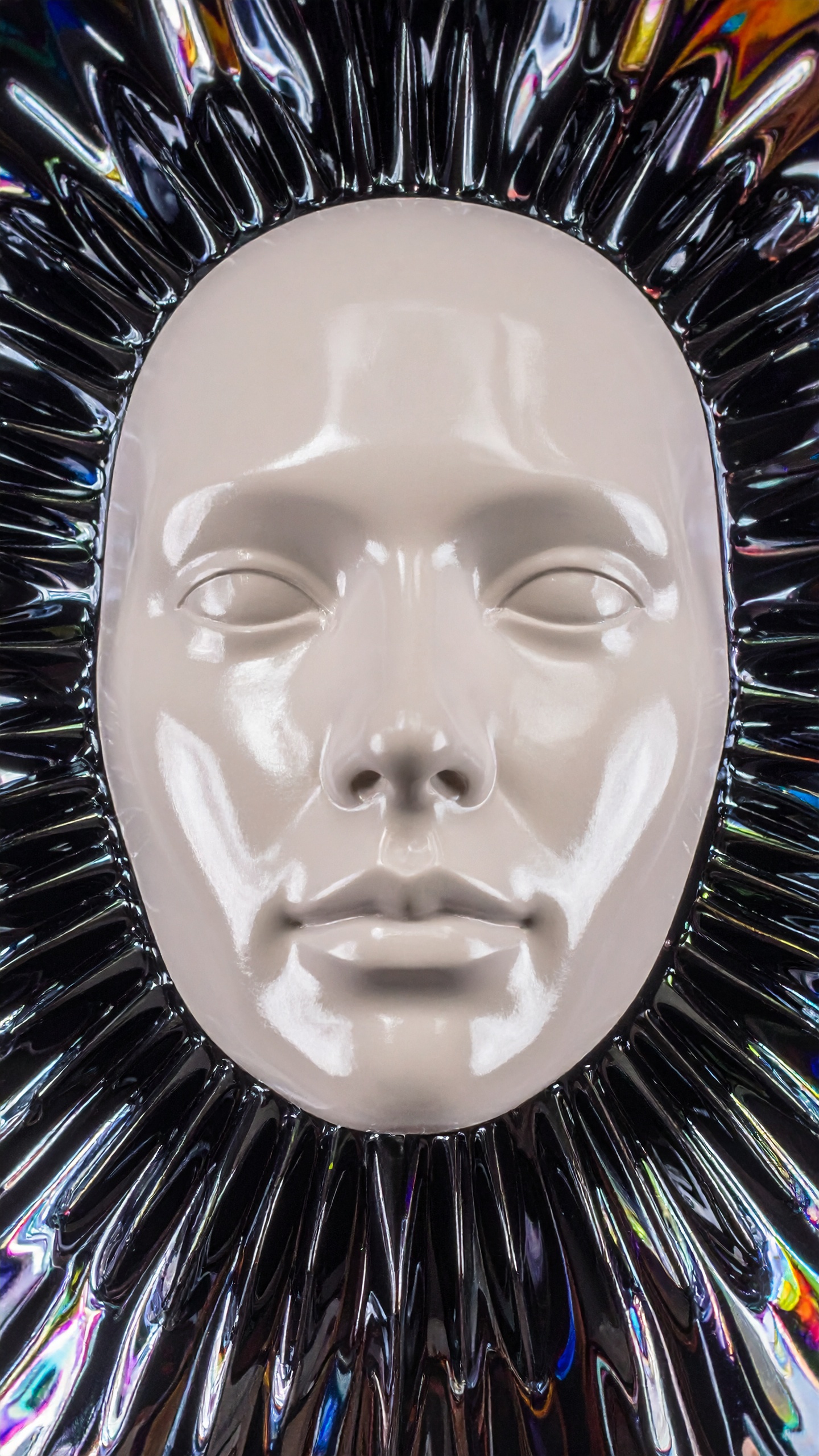 A futuristic mask with a glossy finish is surrounded by a radiant, iridescent frame