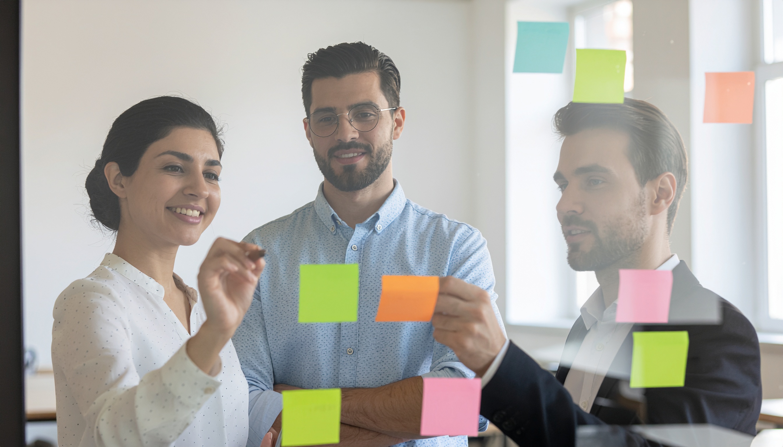 Creative Team Meeting in Office with Colorful Sticky Notes
