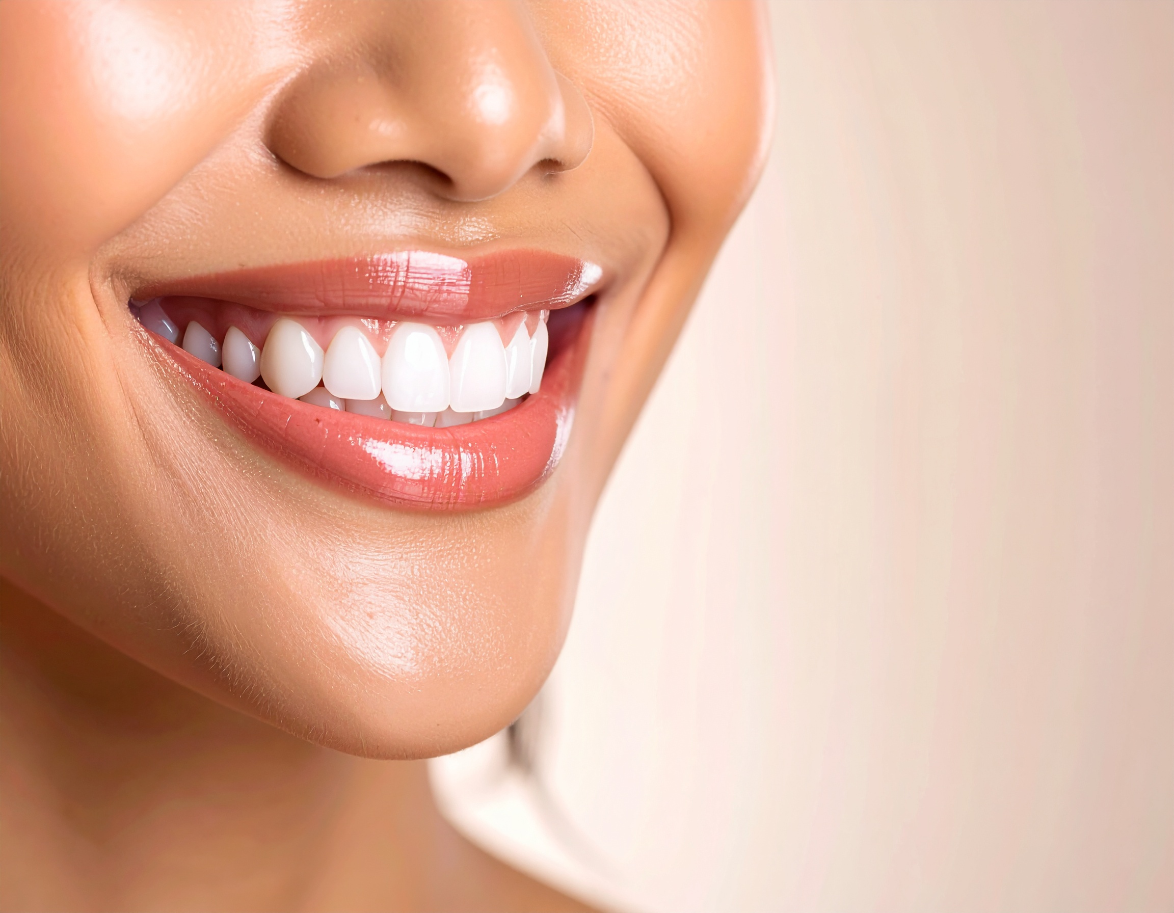 A close-up of a smiling face highlighting bright white teeth