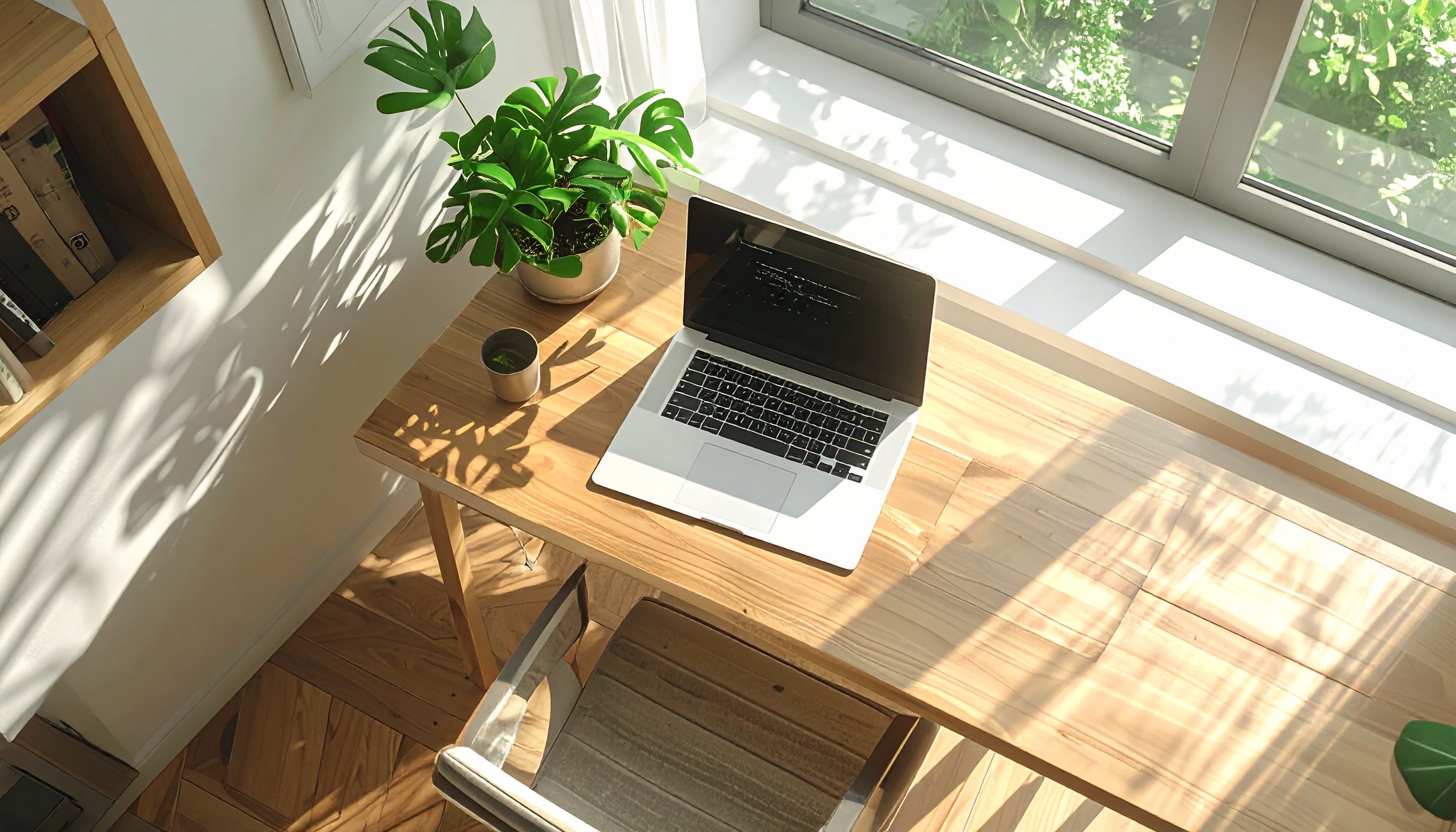 Home Workspace with Open Laptop on Light Wood Desk