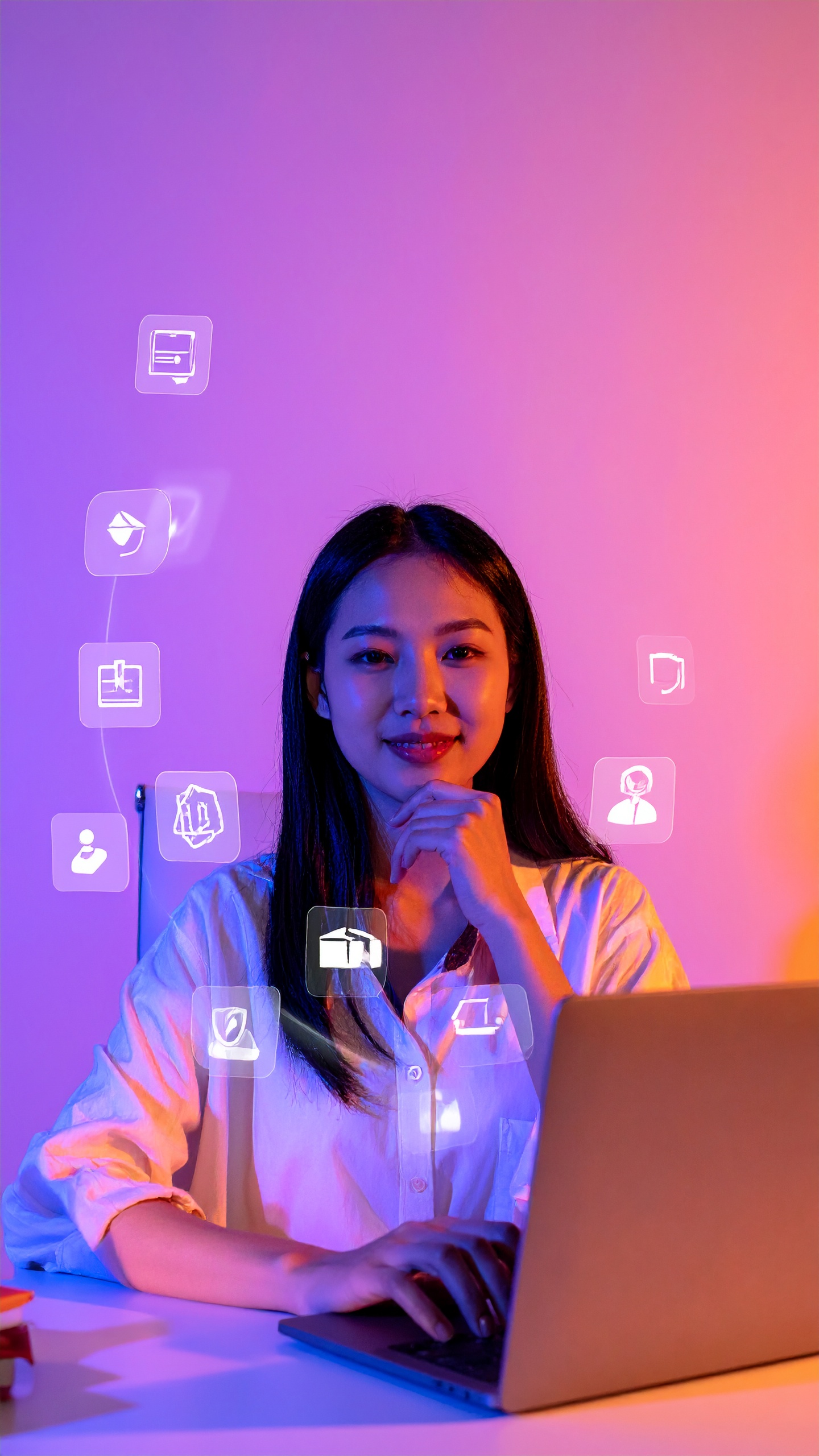 A woman sits at a laptop surrounded by digital icons in a modern workspace