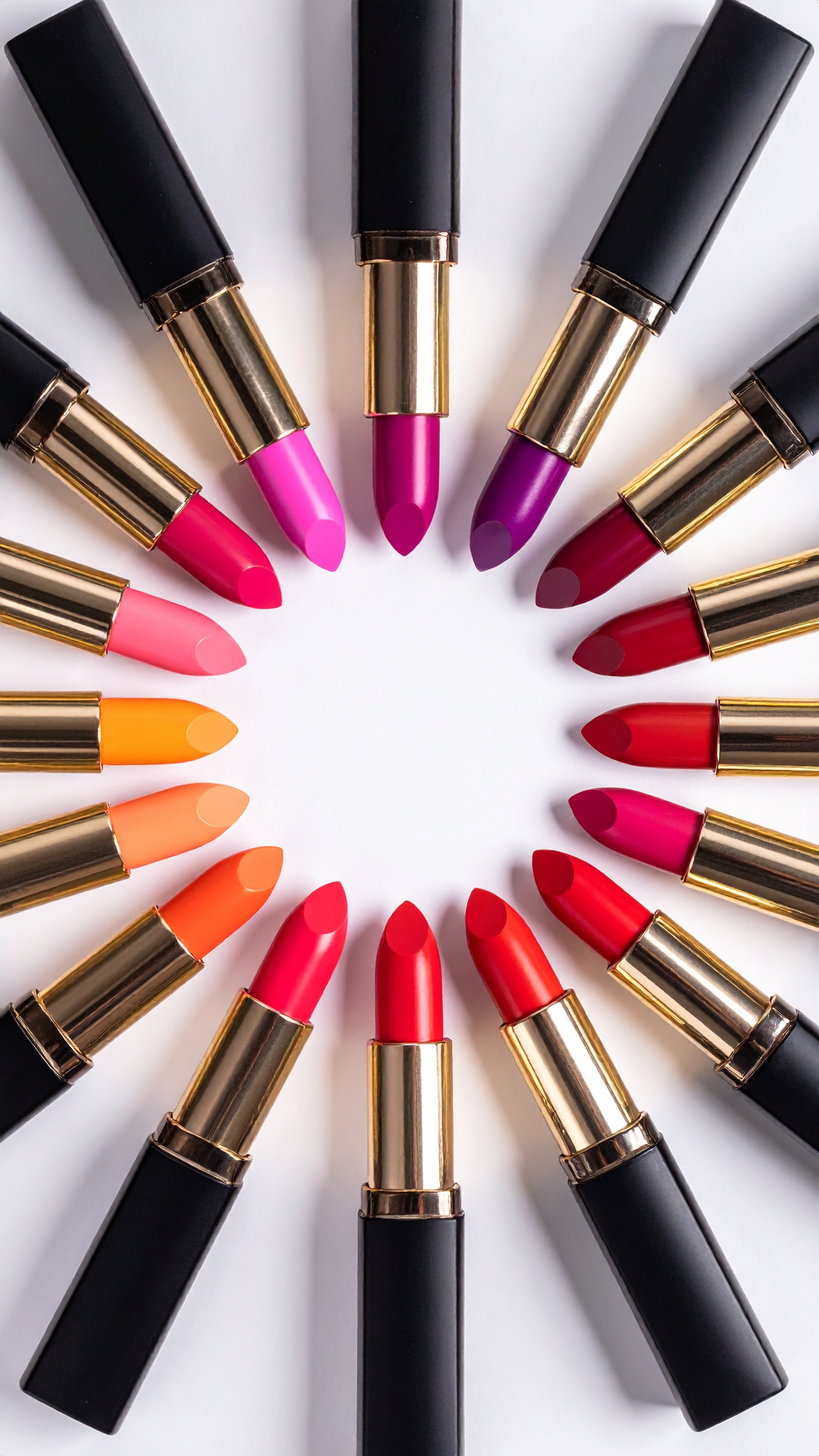 A vibrant array of lipsticks in a circular arrangement showcases a variety of bold colors