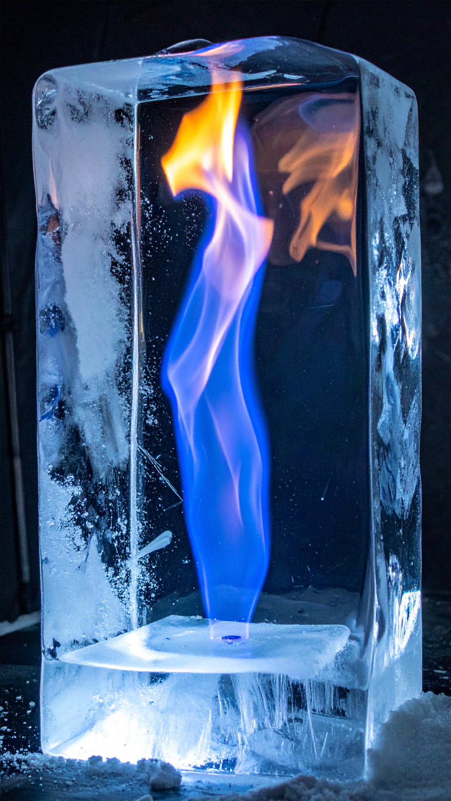 A block of ice encases a vibrant blue flame, creating a striking contrast