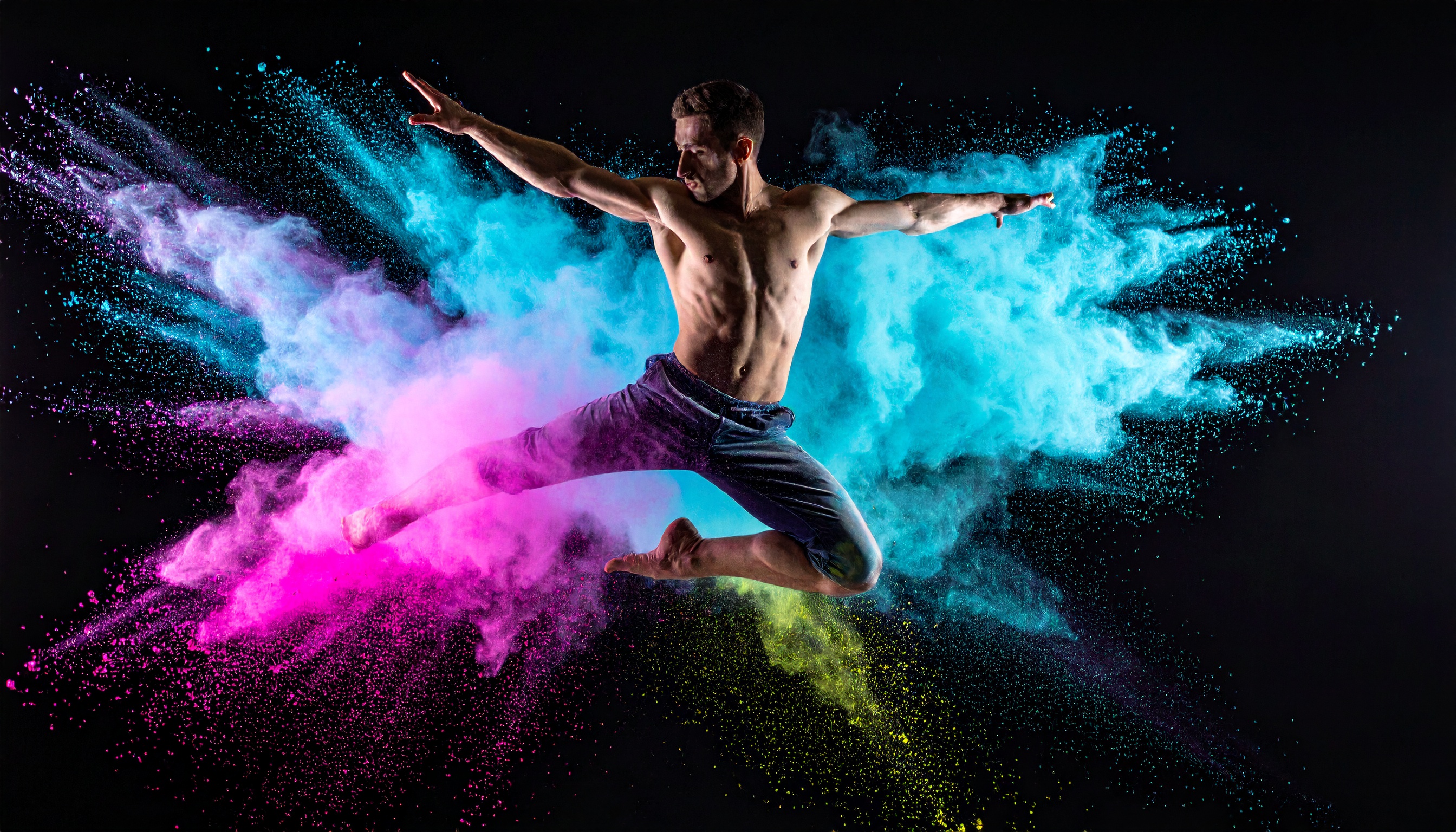 A dynamic dancer leaps through vibrant colored powders against a dark background