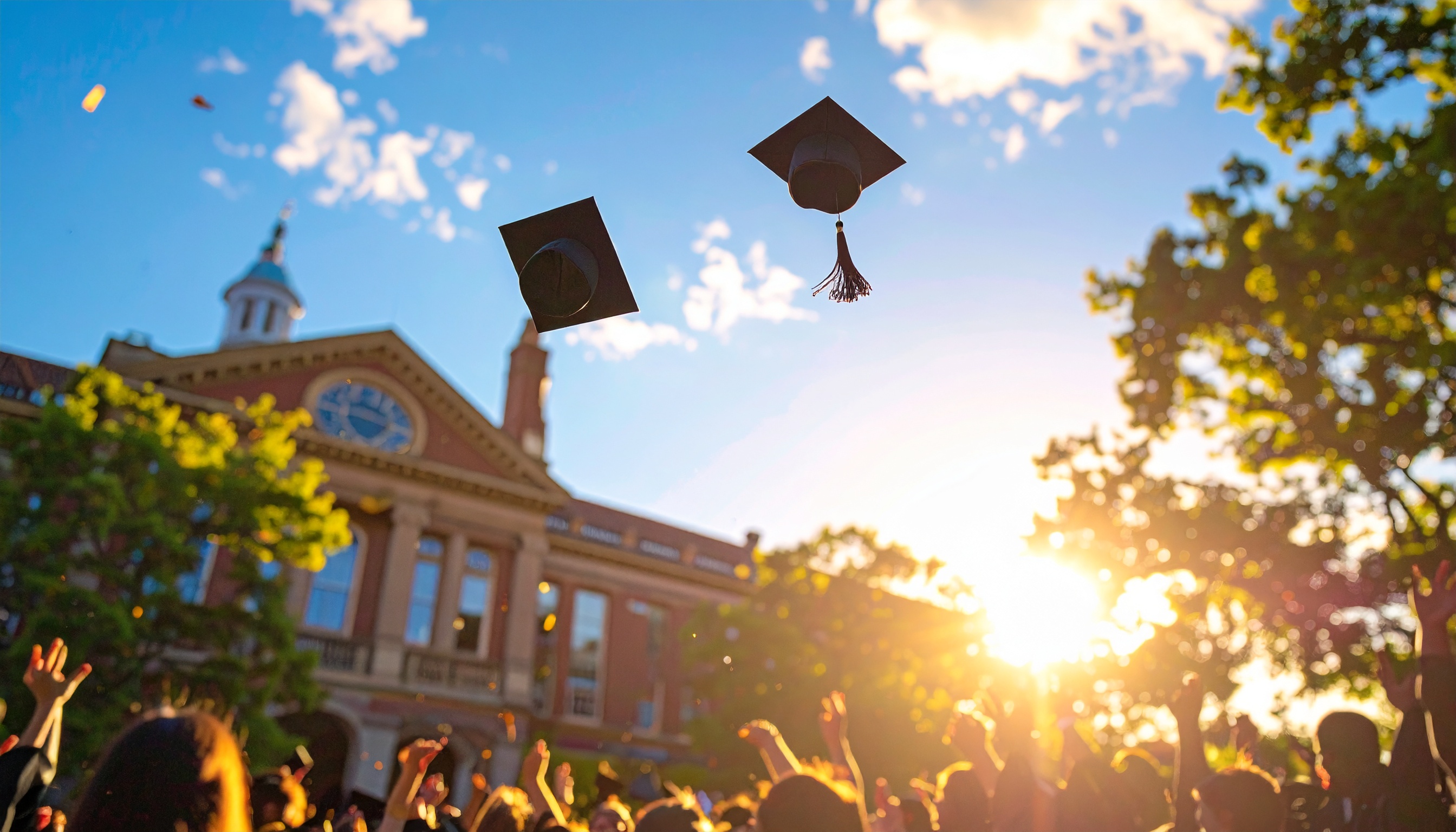 Outdoor Graduation Celebration with Caps in the Air