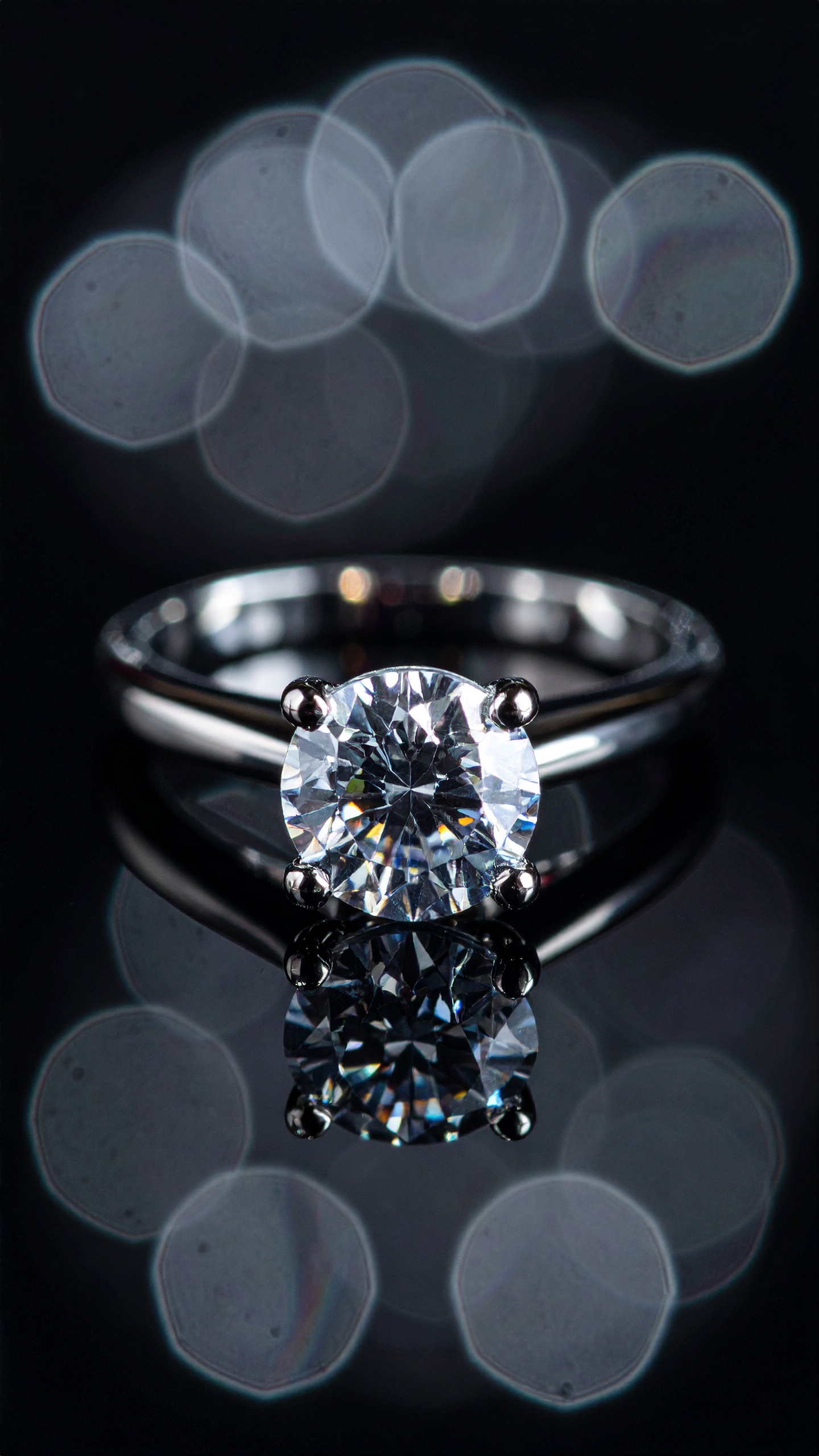 A stunning diamond ring sparkles against a dark background, capturing attention with its brilliance