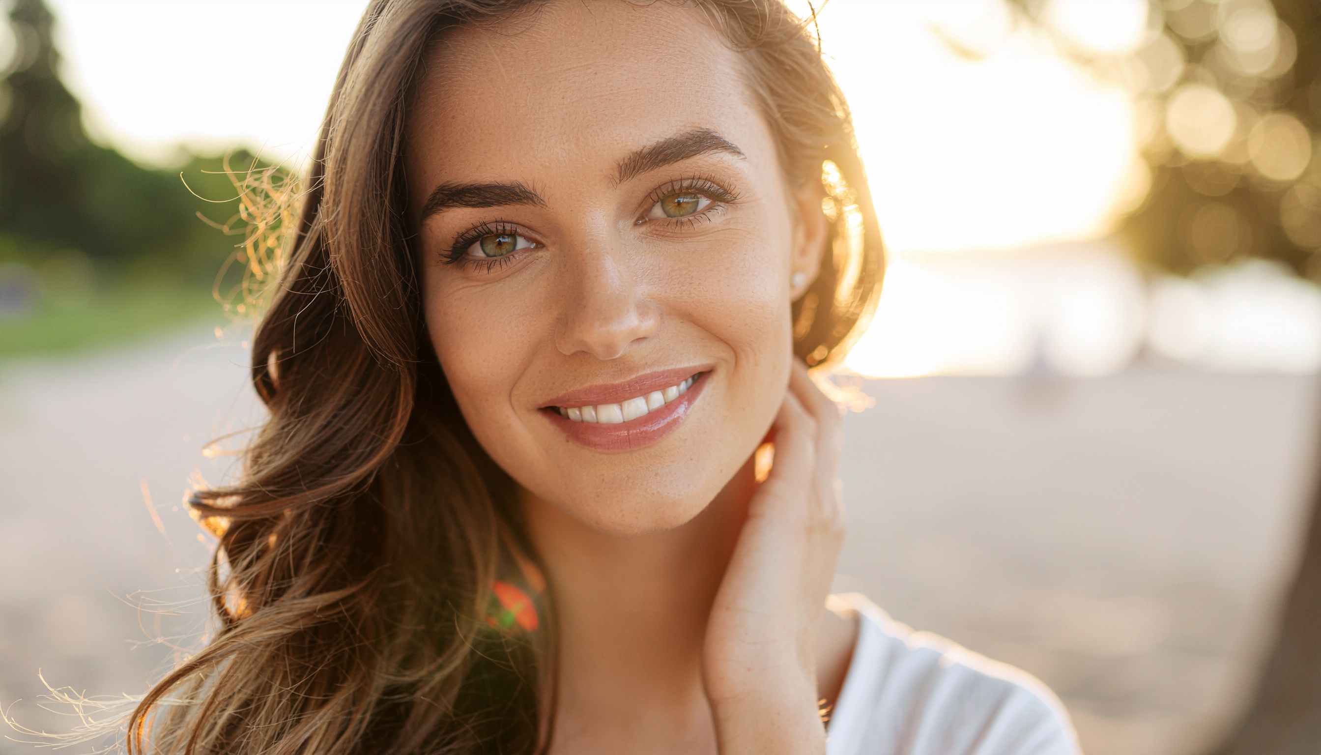 Smiling Woman Portrait at Sunset on a Serene Beach