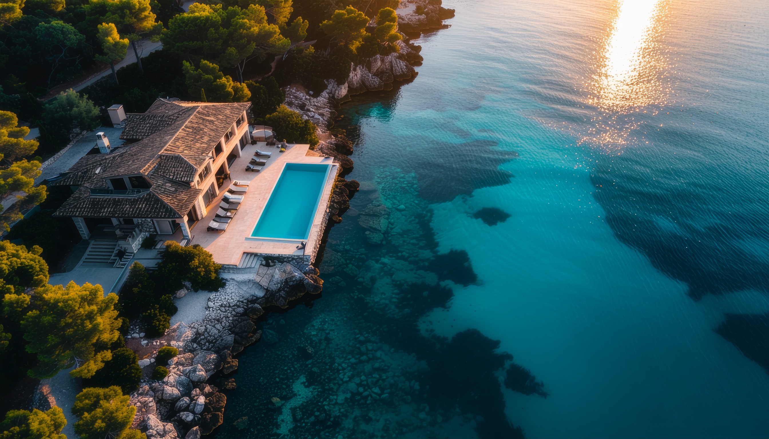 Aerial View of a Luxurious Seaside House with Infinity Pool