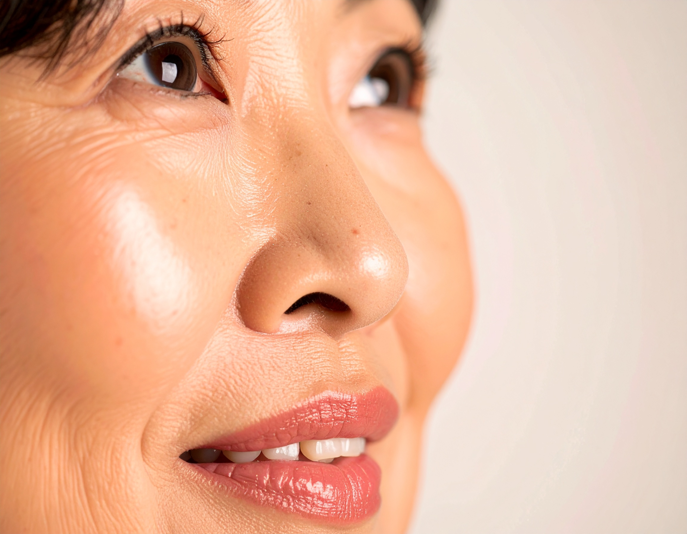 Close-up of a woman's face highlighting skin texture and smoothness