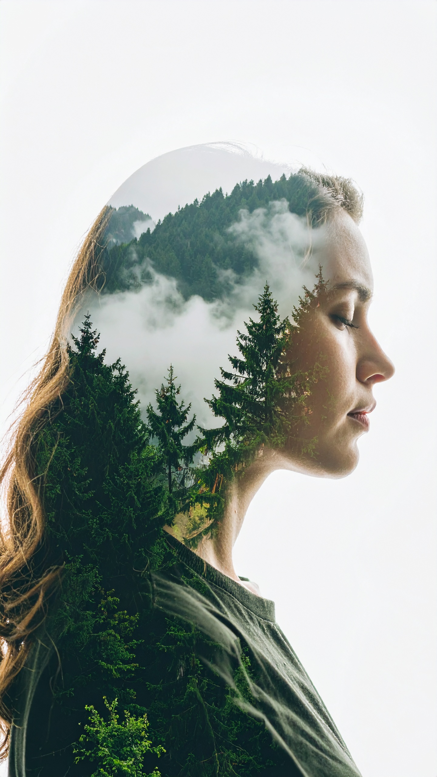 A serene double exposure image blending a woman's profile with a lush forest