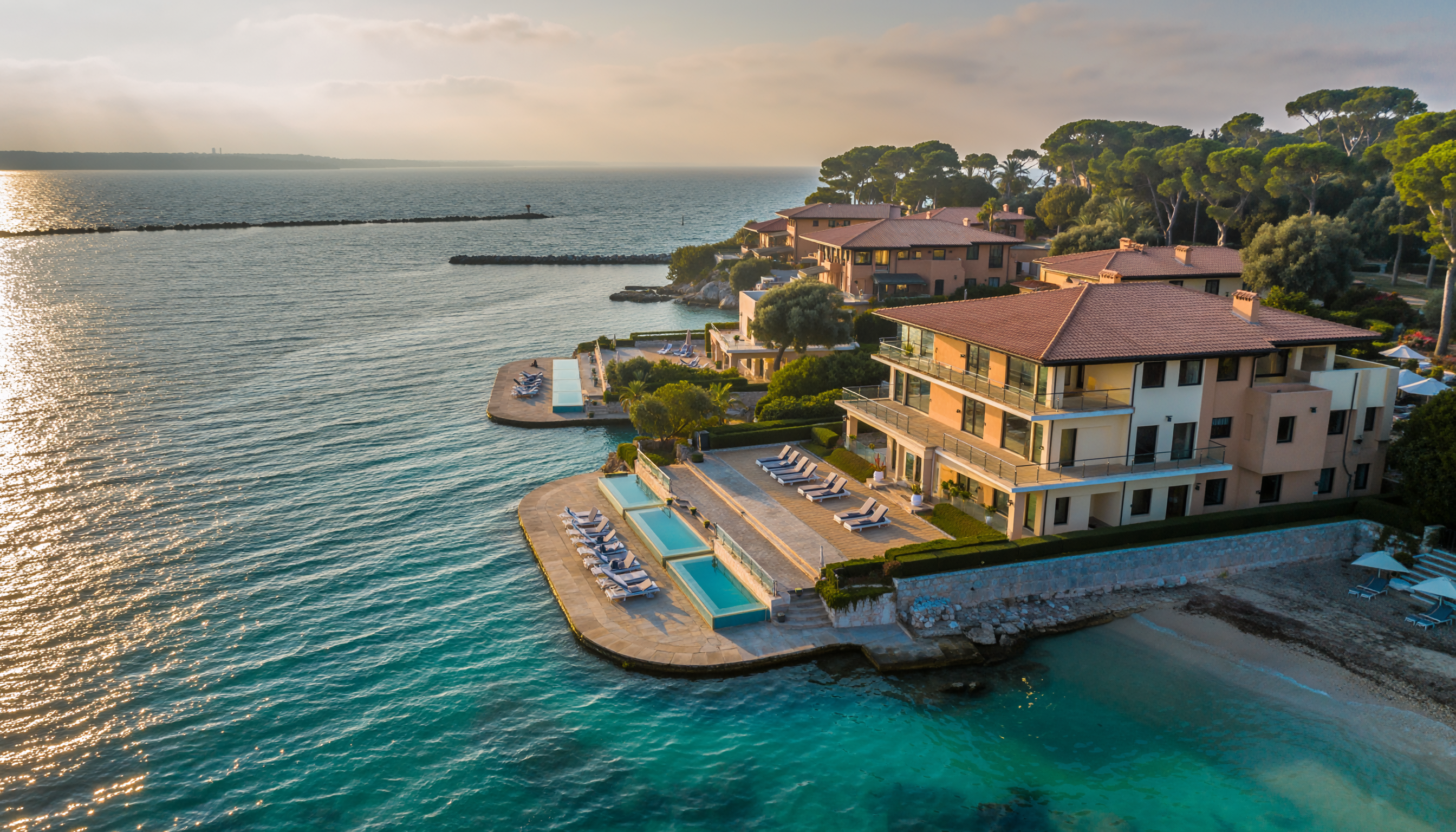 Aerial View of a Luxurious Coastal Mansion at Sunset