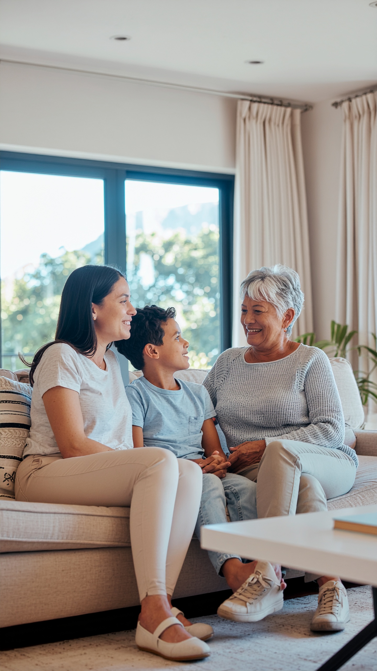 Three Generations of Family Joy in a Sunny Living Room