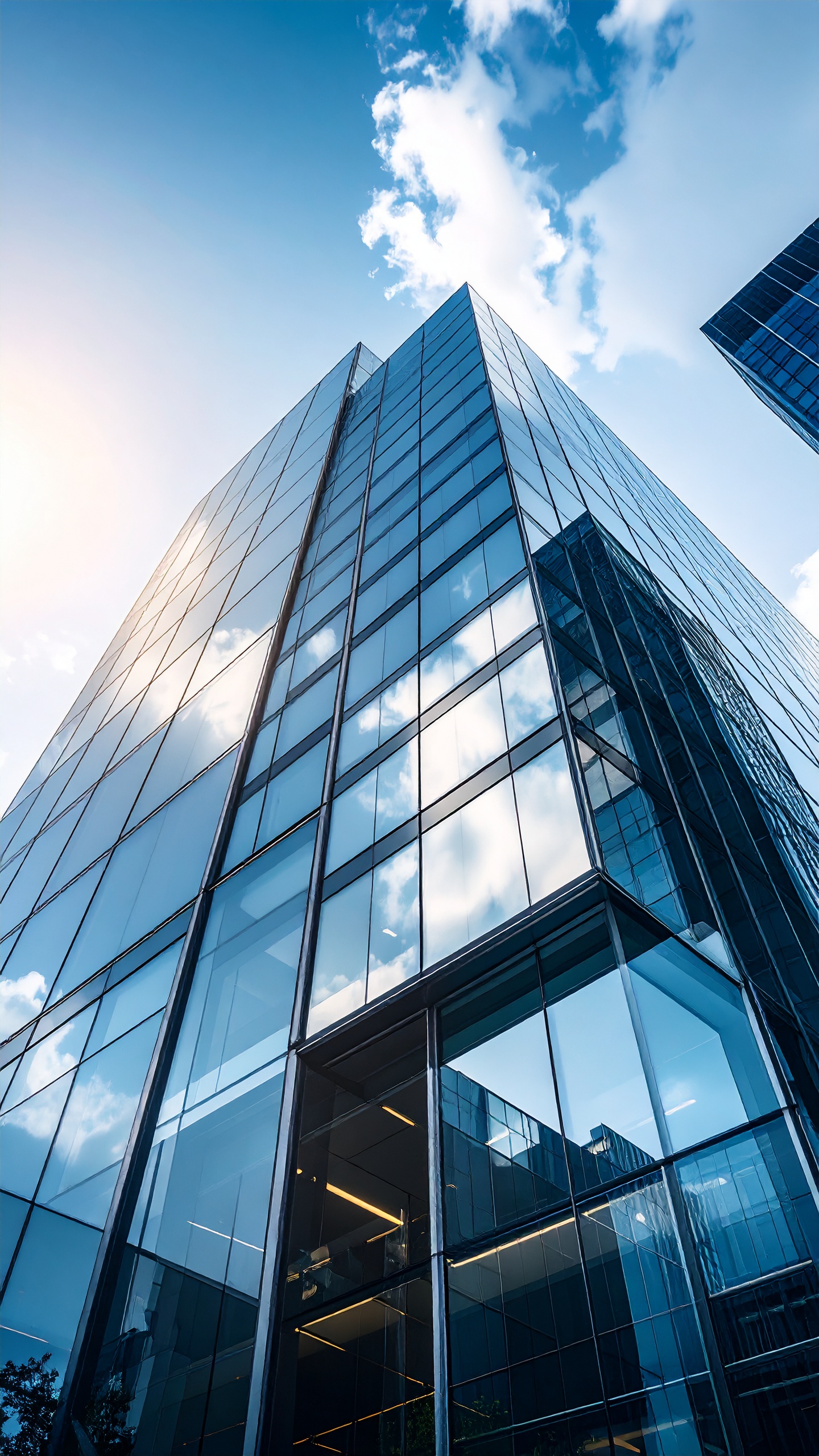 Modern Glass Skyscraper Reflecting Blue Sky