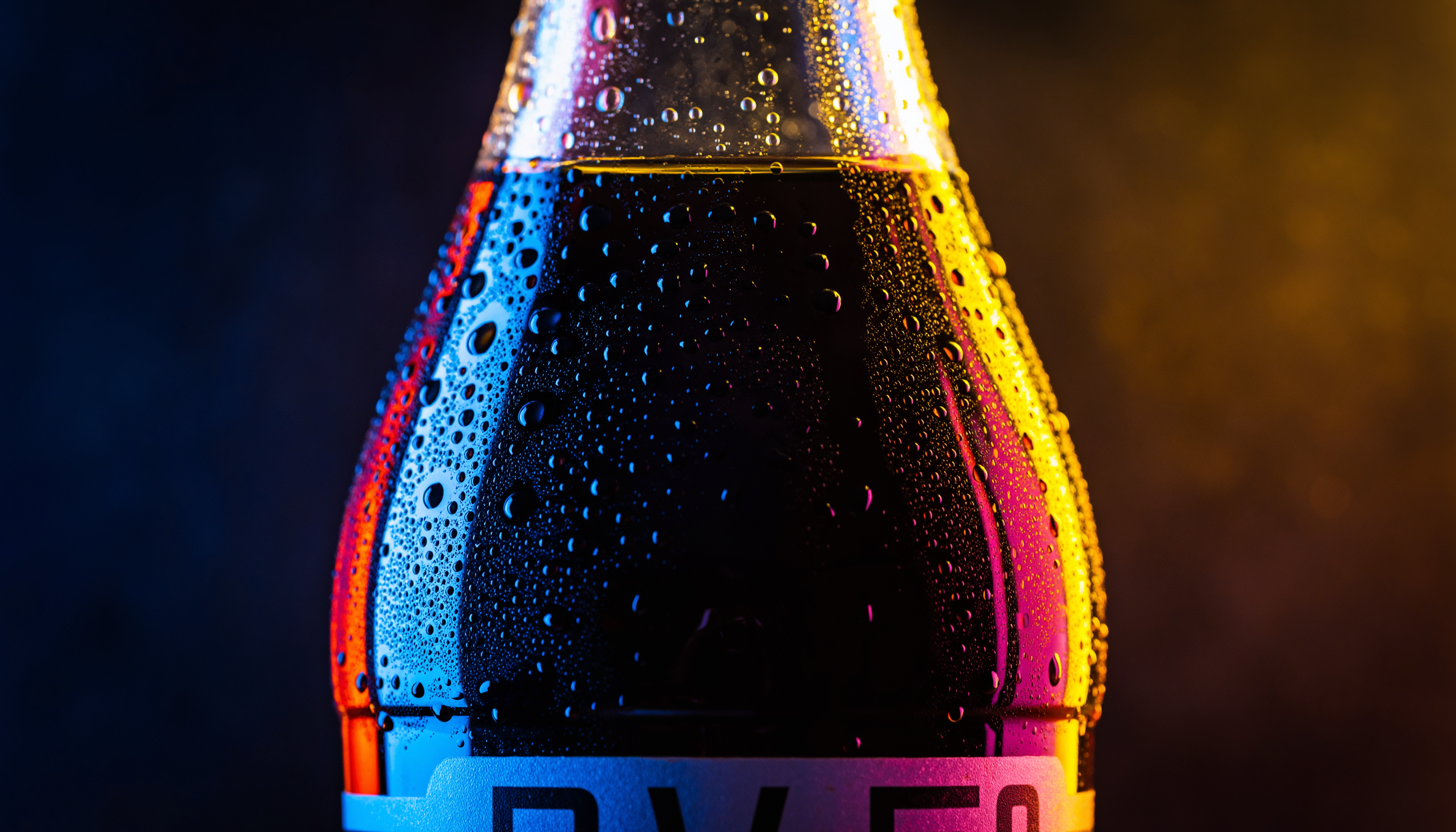Chilled Glass Soda Bottle with Colorful Lighting