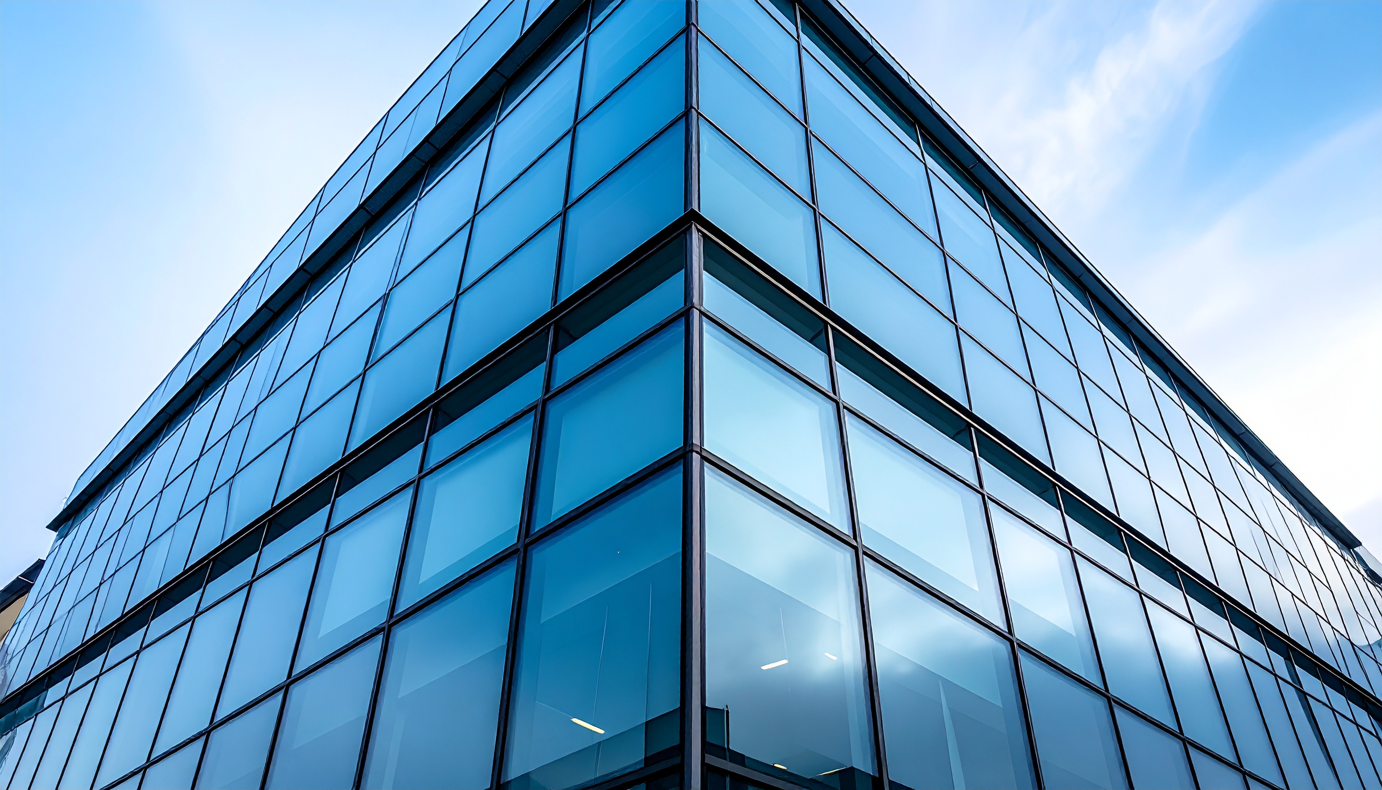 Modern Building with Blue Glass Facade Reflecting the Sky