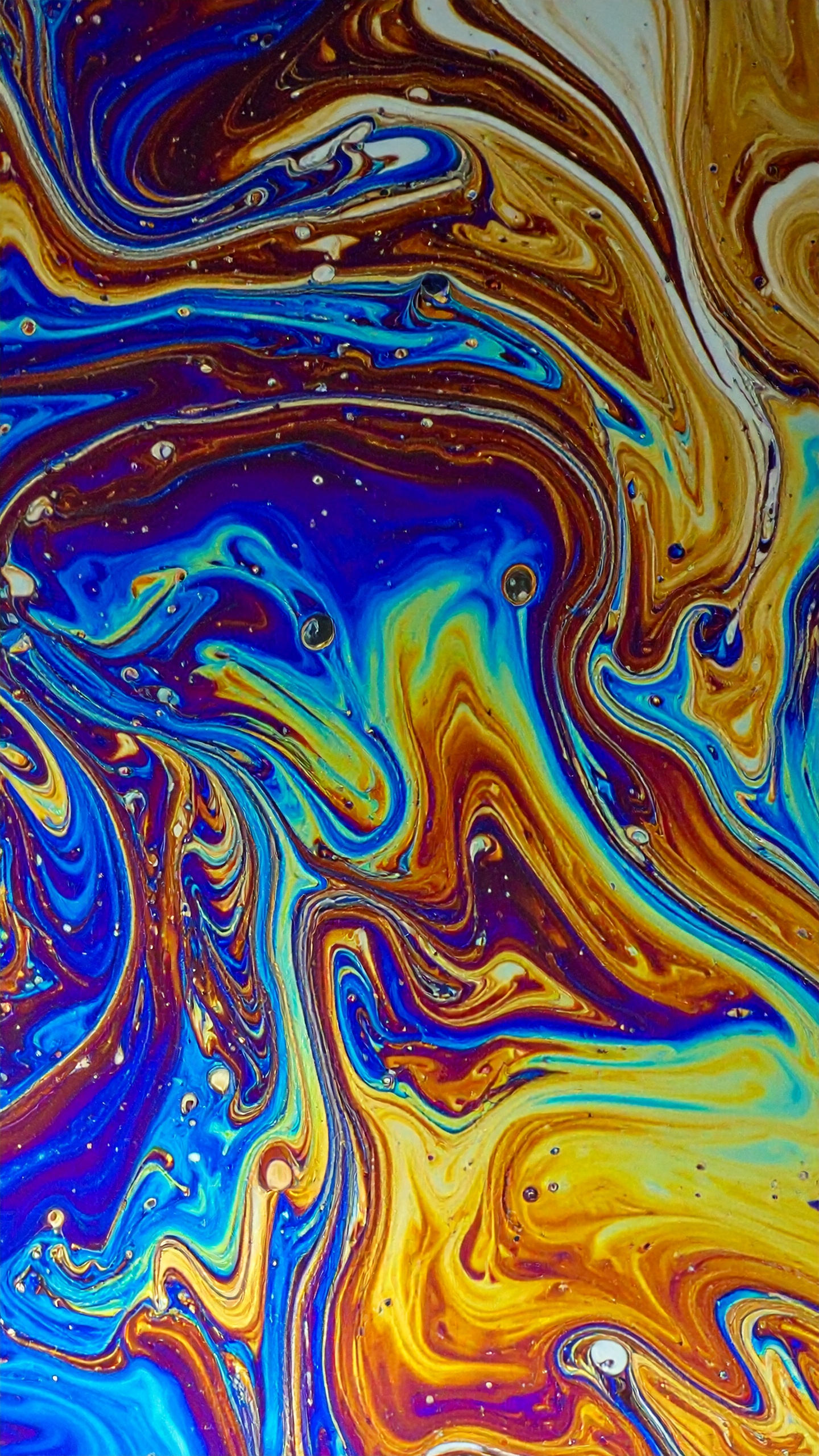 Vibrant abstract swirls in blue, orange, and yellow create a dynamic visual effect
