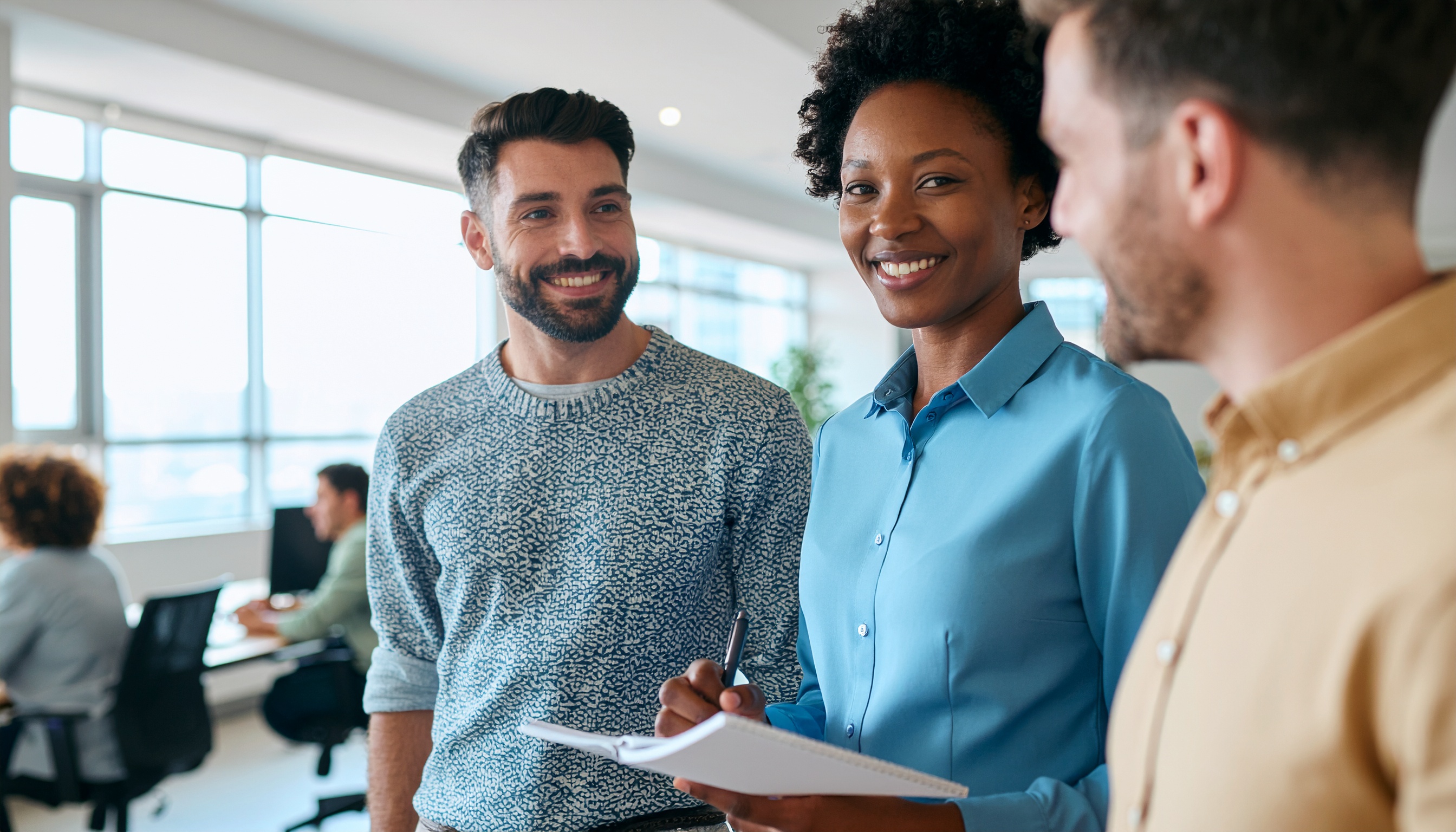 A group of professionals collaborating in a modern office environment