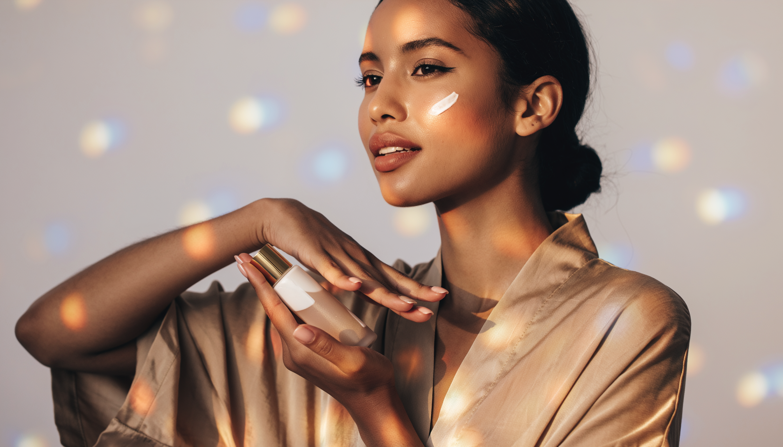 Portrait of a Woman Holding a Cosmetic Bottle