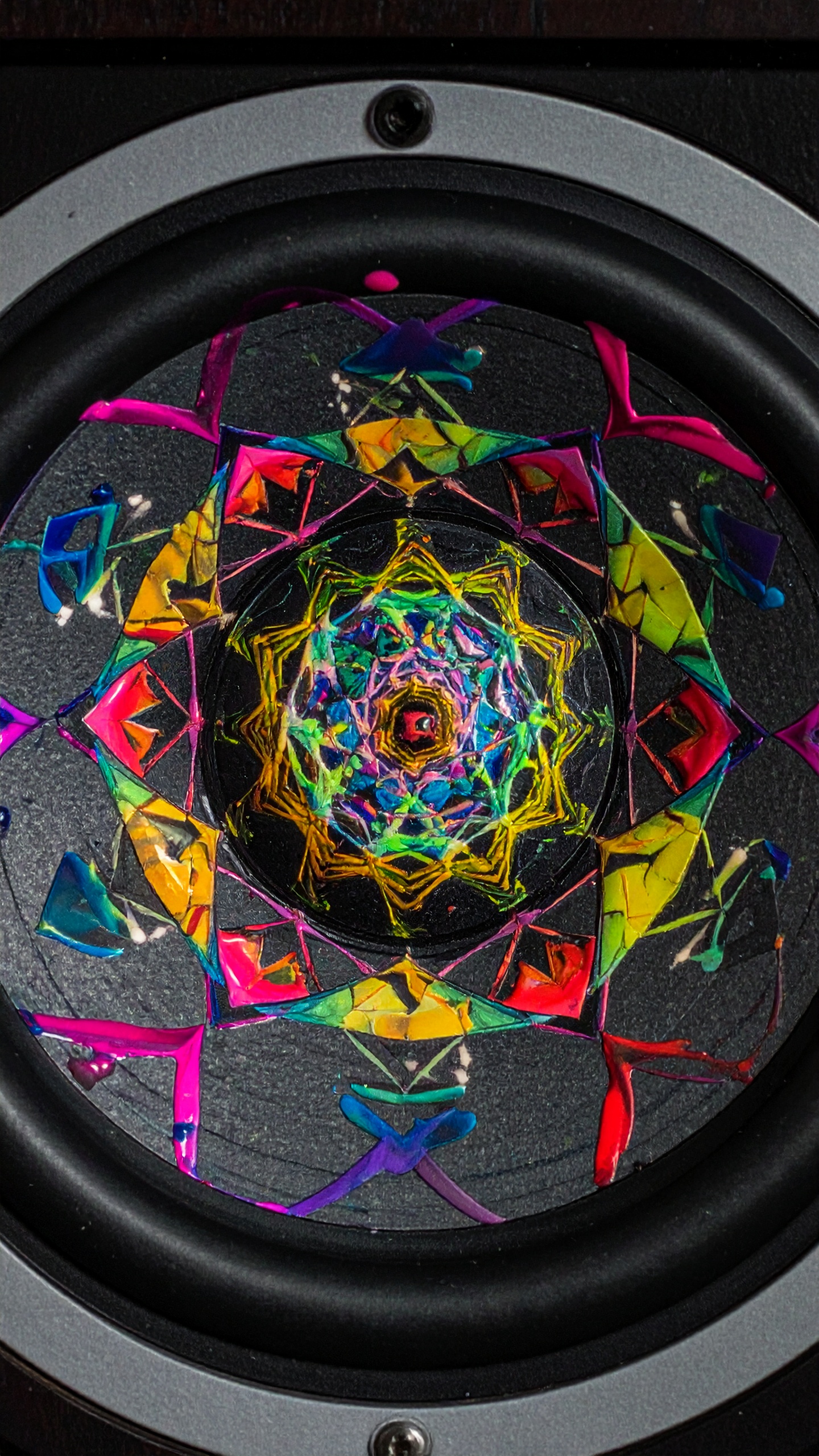Vibrant mandala design on a speaker cone creates a dynamic visual